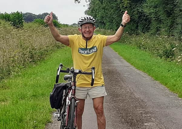 The Rev David Post celebrating reaching his target distance EMN-210930-162206001