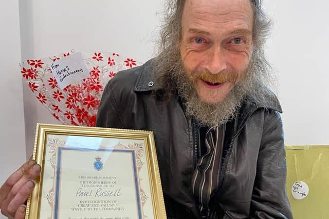 Paul Russell with the High Sherriff's Award he received for his services to the community of Skegness clearing the streets of litter.