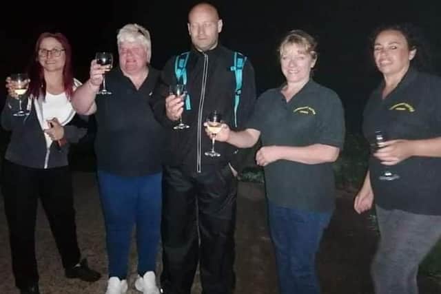 Mick Poole after his 40 mile walk with his wife Charlotte his daughters and members of the Helping Hands committee. EMN-210930-165419001