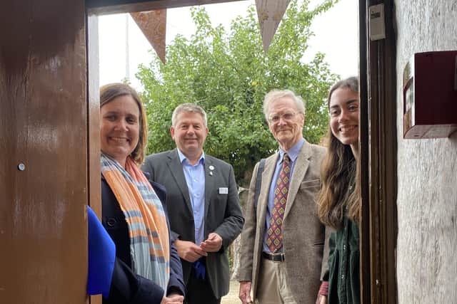 Coun Richard Wright and Malcolm Smith cutting the ribbon to Mrs Smith’s Cottage; joined by Liz Bates from the Heritage Lottery Fund and volunteer Katherine Rowson. EMN-210210-141106001