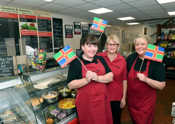 Appetites and their Lincolnshire flags. L-R Tasha Ford, Angie Lloyd, Sarah Graves EMN-210410-101053001