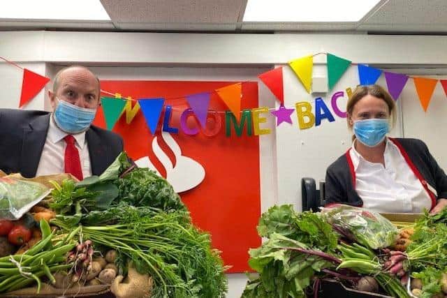 Neil with his colleague, Diane, at the Louth branch - with the veggie gifts they received from one happy customer!