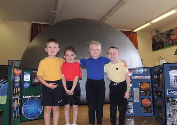 An out of this world experience for Heckington School pupils with a visit from Starlincs Planetarium. From left - Dominykas Urbas, Lucy Howgate, Julija Kalanina and Trystan Almond. EMN-210810-164047001
