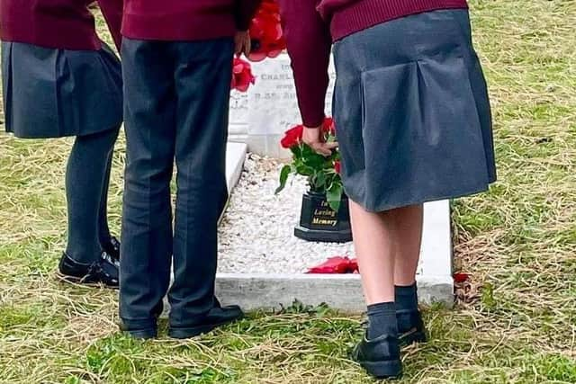 After the service a small party walked round to Sleaford cemetery, where Charlie Penson's funeral was held 100 years ago and Father Philip Johnson gave a short blessing before they laid wreaths on his grave. EMN-210610-154523001