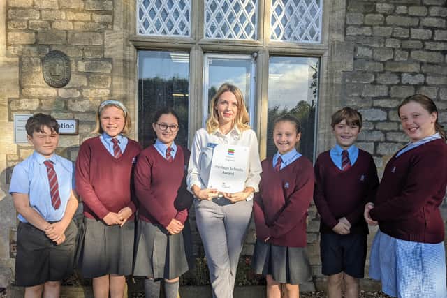 Kate Argyle from Historic England presented the school, the children and particularly Year 6 teacher Natalie Mason, with a special award for bringing history to life. EMN-210610-154153001