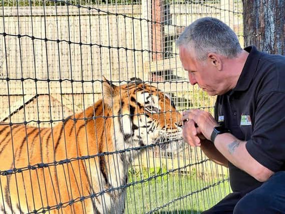 Steve Nichols, CEO of the Lincolnshire Wildlife Park, with Princess.