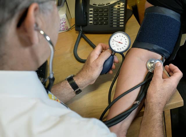 EMBARGOED TO 0001 WEDNESDAY JANUARY 18 File photo dated 10/09/14 of a GP using a stethoscope. Normalising hearing checks among adults in their 30s could help ward off some dementias in later life, experts have suggested. Issue date: Wednesday January 18, 2023.