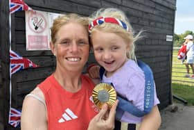 Eventing rider Ros Canter shows off her Olympic gold medal with five-year-old daughter, Ziggy.