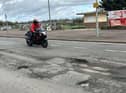 Potholes along the seafront are so deep they could kill, warns a former motorcyclist.