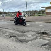 Potholes along the seafront are so deep they could kill, warns a former motorcyclist.