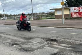 Potholes along the seafront are so deep they could kill, warns a former motorcyclist.
