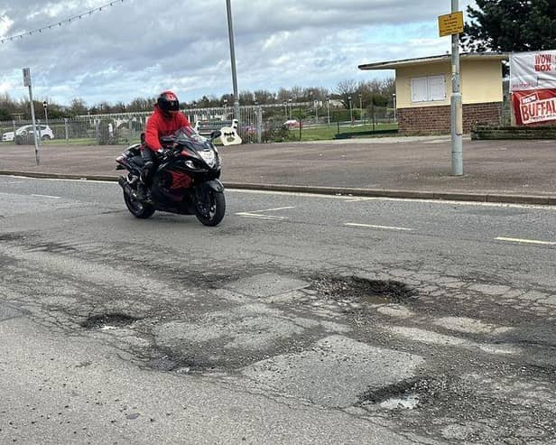 Potholes along the seafront are so deep they could kill, warns a former motorcyclist.