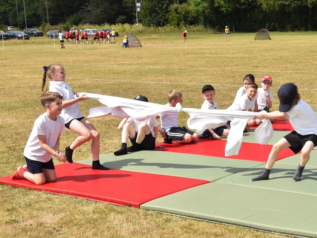 Children joining in a tug of war game at the Community Games Day.