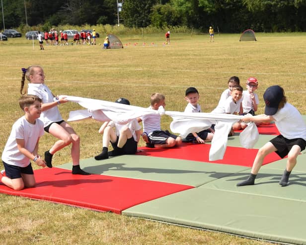 Children joining in a tug of war game at the Community Games Day.