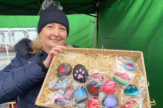 Helen Thorpe with her painted pebbles.