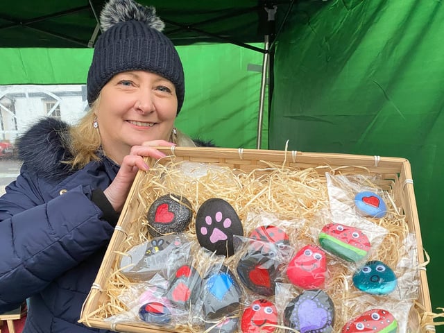 Helen Thorpe with her painted pebbles.