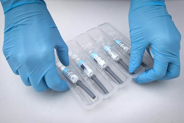 File photo dated 26/09/2020 of a nurse preparing flu vaccine jabs. People are being urged to get their flu jabs to help relieve pressure on the NHS ahead of winter.