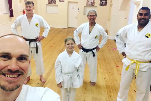 Craig Sanderson (left) with students