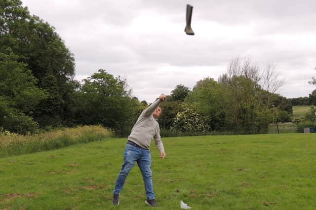 Bob Pleasance lets fly in the welly wanging at Leasingham's jubilee fun day.