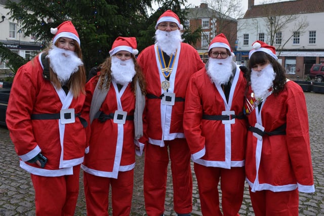 Rotary president John Moore with some of his fellow Santa runners - Amber, Jorja, Lorraine and birthday girl Hollie