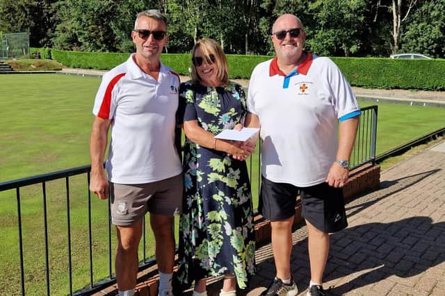 Amber Care Open Bowls Tournament winners (left) Steve Bowden and Nigel Flosdick pictured with Amber Care MD Bronia Johnson.
