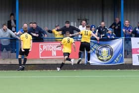 Trinity celebrate Saturday's late winner with their fans.