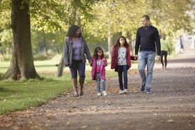Families enjoying an autumn walk. Photo: National Trust Images/Arnhel de Serra