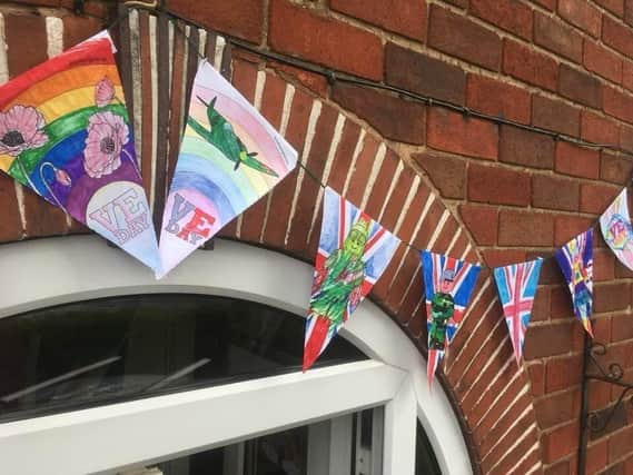 Home-made bunting from 2020 on the 75th anniversary.