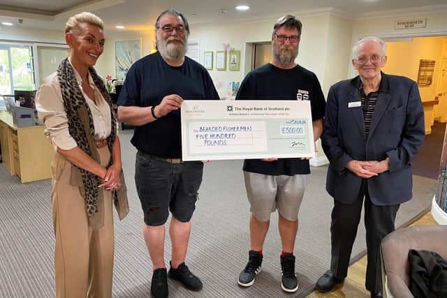 Peter and Sarah present the cheque