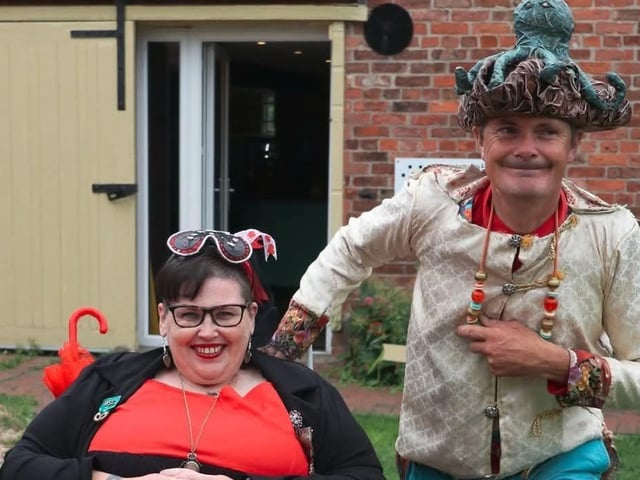 Alice Queen of Hearts and Robert the Penny Farthing man racing and chasing the White Rabbit