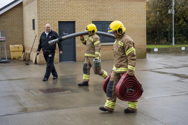 Would-be recruits are challenged to carry the heavy equipment needed at incidents. Photo: Holly Parkinson