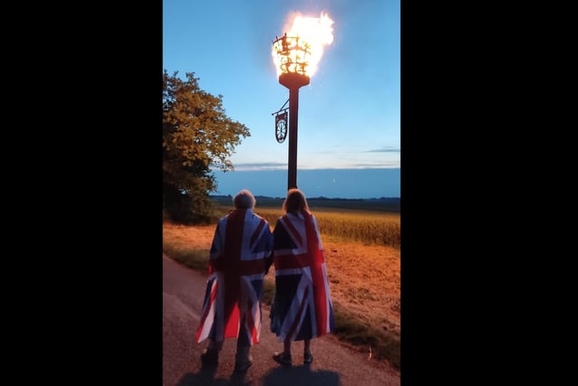 Tom Harden captured this atmospheric shot of villagers in Frampton watching the lighting of the beacon on Thursday.