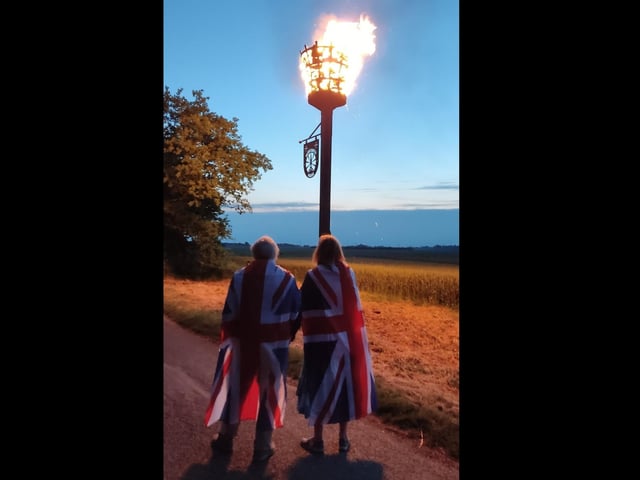 Tom Harden captured this atmospheric shot of villagers in Frampton watching the lighting of the beacon on Thursday.