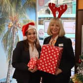 Sleaford Travel colleagues, from left - Fallon McGilloway, Travel Apprentice, and Amanda Hurry, Branch Manager, with toys collected.