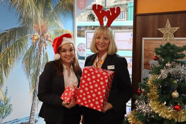 Sleaford Travel colleagues, from left - Fallon McGilloway, Travel Apprentice, and Amanda Hurry, Branch Manager, with toys collected.