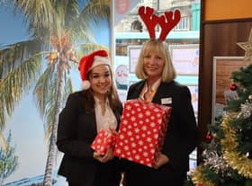 Sleaford Travel colleagues, from left - Fallon McGilloway, Travel Apprentice, and Amanda Hurry, Branch Manager, with toys collected.