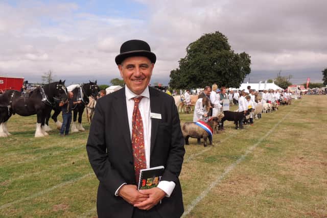 Fantastic relaunch of two-day show - chairman Charles Pinchbeck in the ring for the grand parade of livestock.
