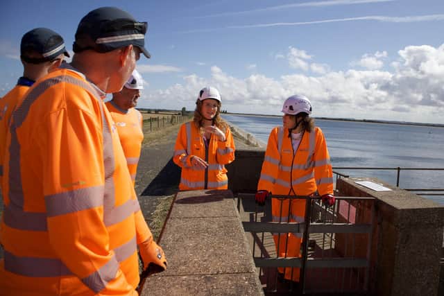 The Conservative MP for Louth and Horncastle, Victoria Atkins (right), meets engineers from Anglian Water at Covenham Reservoir.