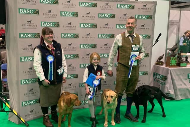 ​Elodie proudly displaying her second-place rosette in the BASC Gundog Team Event. Image: Tom Unwin