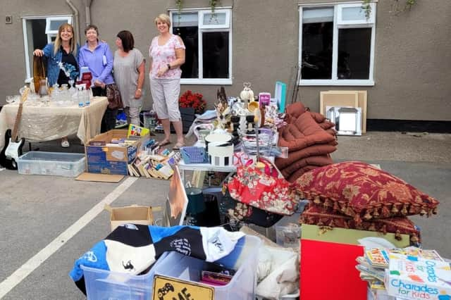 Churchwarden Stephanie Baines (left) with helpers at the Misterton car boot sale