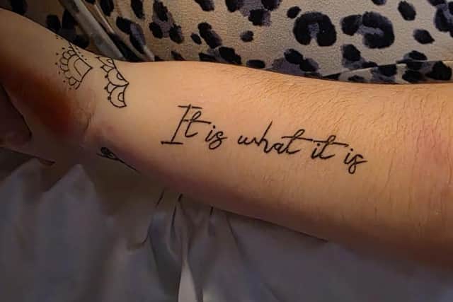 'It is what it is' - Ella's motto, tattooed on her arm.