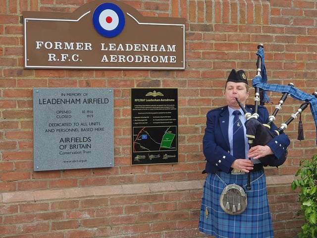 Bagpiper Kirsteen Macdonald performs for the unveiling ceremony.