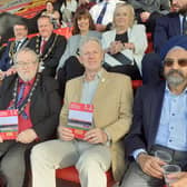 Sleaford's Deputy Mayor Coun David Suiter (left) and former mayor Coun Robert Oates join the crowd supporting the charity memorial match at Lincoln City.