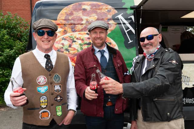 Distinguished Gentlemen share a drink.