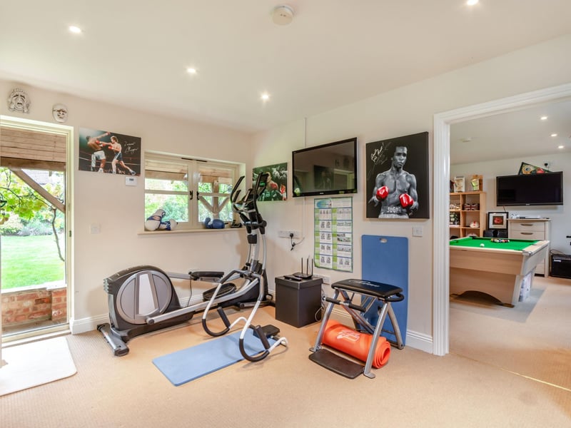 The gym and games room inside the outbuilding.