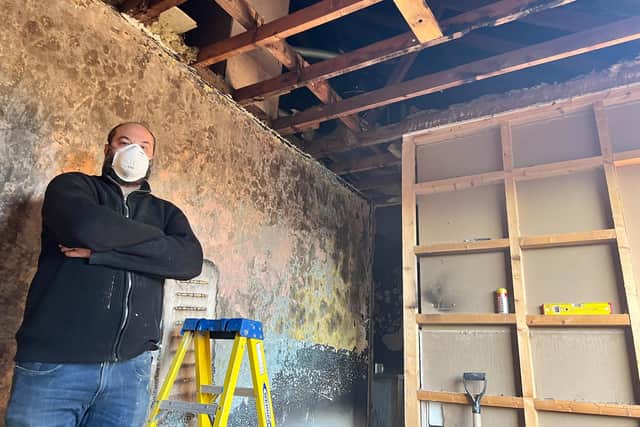 Graham Nicholls, pictured in one of the fire-damaged bedrooms which they have already started to repair.