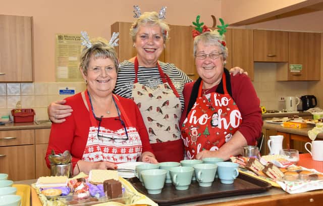 Elaine Eccles, Marilyn Moore and Sue Binns serving refreshments