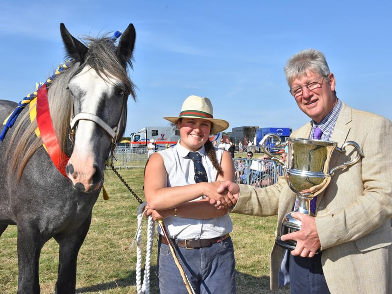 Supreme Champion in the heavy horse class was Lucy Flintham from Southwell, receiving the trophy from local farmer Chris Bourn.