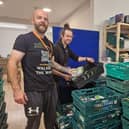Tim Jones (left) back volunteering at The Storehouse Church food bank with Restore Centre and food bank manager Jonny Whelbourn.