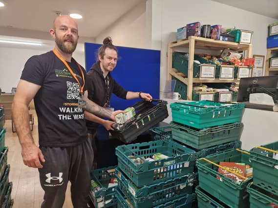 Tim Jones (left) back volunteering at The Storehouse Church food bank with Restore Centre and food bank manager Jonny Whelbourn.